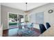 Cozy breakfast nook with sliding glass doors and a modern chandelier at 1381 N Alexis Dr, Gilbert, AZ 85234