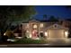 Charming two-story home with a well-manicured lawn and a welcoming red front door at 1381 N Alexis Dr, Gilbert, AZ 85234