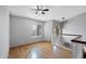 Second floor hallway with hardwood floors, a large window, and a railing overlooking the lower level at 1381 N Alexis Dr, Gilbert, AZ 85234