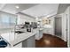 Modern kitchen featuring an island, white cabinetry, granite countertops, and stainless steel appliances at 1381 N Alexis Dr, Gilbert, AZ 85234