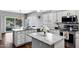 Well-lit kitchen featuring granite countertops, stainless steel appliances, and ample cabinet space at 1381 N Alexis Dr, Gilbert, AZ 85234