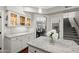 Kitchen with granite countertops, custom cabinets, and an adjacent dining room visible through an archway at 1381 N Alexis Dr, Gilbert, AZ 85234