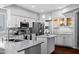 Bright kitchen featuring granite countertops, stainless steel appliances, and white cabinets at 1381 N Alexis Dr, Gilbert, AZ 85234