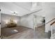 Spacious living room featuring neutral tones, plush carpet, and staircase at 1381 N Alexis Dr, Gilbert, AZ 85234