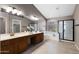 Luxurious main bathroom featuring dual vanities, a glass-enclosed shower, and a soaking tub at 1381 N Alexis Dr, Gilbert, AZ 85234