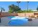 Backyard featuring a pebble tec swimming pool, a patio area and lounge chairs, perfect for relaxation at 1381 N Alexis Dr, Gilbert, AZ 85234