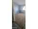 Spacious bedroom with a large window and plush carpeting at 14620 N 31St Ln, Phoenix, AZ 85053