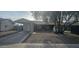 Charming single-story home with a covered front porch and mature shade tree at 14620 N 31St Ln, Phoenix, AZ 85053