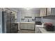 Modern kitchen with stainless steel appliances, including a refrigerator and a stove at 14620 N 31St Ln, Phoenix, AZ 85053