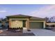 Charming single-story home featuring brick accents, a two-car garage and desert landscaping at 15635 W Hackamore Dr, Surprise, AZ 85387