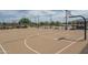 Well-maintained outdoor basketball court with benches, landscaping, and lighting for community enjoyment and recreational activities at 15784 W Soft Wind Dr, Surprise, AZ 85387