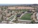 Aerial view of a manicured community park with green space and pickleball courts at 15784 W Soft Wind Dr, Surprise, AZ 85387