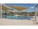 Modern pool area with shallow water and shade at 15784 W Soft Wind Dr, Surprise, AZ 85387