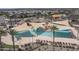 Aerial view of a modern pool area with sun shades at 15784 W Soft Wind Dr, Surprise, AZ 85387