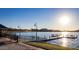 Community lake with benches, walking path, beautiful landscaping and mountain views at the Estrella community in Arizona at 15899 S 183Rd Dr, Goodyear, AZ 85338