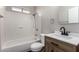 Bright bathroom features a shower and tub combination with updated vanity at 1617 W Vineyard Rd, Phoenix, AZ 85041
