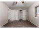 Cozy bedroom featuring neutral carpet, walk-in closet, and ceiling fan at 1617 W Vineyard Rd, Phoenix, AZ 85041