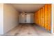 Carport with interior storage shows access door to the home at 1617 W Vineyard Rd, Phoenix, AZ 85041