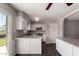 Bright kitchen features white cabinets, granite countertops, and stainless steel appliances at 1617 W Vineyard Rd, Phoenix, AZ 85041