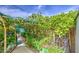 Lush backyard featuring a charming garden walkway, vibrant plants, decorative elements and serene setting for relaxation and enjoyment at 17374 W Adams St, Goodyear, AZ 85338