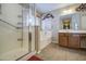 Well-lit bathroom with a walk-in shower and separate soaking tub at 17374 W Adams St, Goodyear, AZ 85338