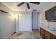 Bedroom featuring carpet, ceiling fan, closet, and neutral color scheme at 17374 W Adams St, Goodyear, AZ 85338