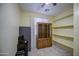 Minimalist bedroom with built in shelves and natural light at 17374 W Adams St, Goodyear, AZ 85338