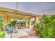 Inviting covered patio with comfortable seating, decorative plants, and ambient lighting for outdoor enjoyment at 17374 W Adams St, Goodyear, AZ 85338