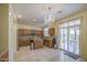 Well-lit kitchen with wood cabinets, granite countertops, and stainless-steel appliances at 17374 W Adams St, Goodyear, AZ 85338