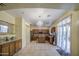 Elegant kitchen with wood cabinets, stainless steel appliances, and a central island at 17374 W Adams St, Goodyear, AZ 85338