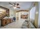 Spacious living room with tile floors, a decorative chandelier, and stair access at 17374 W Adams St, Goodyear, AZ 85338