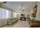 Inviting living room featuring tile floors, a ceiling fan, and a comfortable sofa at 17374 W Adams St, Goodyear, AZ 85338