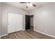 Bedroom features closet, ceiling fan, and sleek flooring at 18008 W Tina Ln, Surprise, AZ 85387