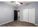 Bedroom features closet, ceiling fan, and sleek flooring at 18008 W Tina Ln, Surprise, AZ 85387