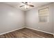 Bedroom features wood-look flooring and neutral paint at 18008 W Tina Ln, Surprise, AZ 85387