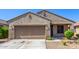 Charming single-story home showcasing a well-manicured lawn and a neutral-toned exterior at 18008 W Tina Ln, Surprise, AZ 85387