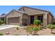 Inviting single-story home with desert landscaping adding charm to its well-maintained exterior at 18008 W Tina Ln, Surprise, AZ 85387