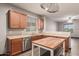 A spacious kitchen with stainless steel appliances, a center island with wood top, and plenty of cabinet space at 18008 W Tina Ln, Surprise, AZ 85387