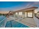 Back patio overlooking the lake, highlighting the seamless indoor-outdoor living space at 2094 N Sweetwater Dr, Casa Grande, AZ 85122