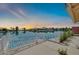 Back patio featuring a serene view of the lake, perfect for relaxing and entertaining at 2094 N Sweetwater Dr, Casa Grande, AZ 85122