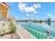 Waterfront view from the back patio featuring a beautiful lake with fountain and homes at 2094 N Sweetwater Dr, Casa Grande, AZ 85122