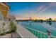 Waterfront view from the back patio featuring a beautiful lake with fountain and homes at 2094 N Sweetwater Dr, Casa Grande, AZ 85122