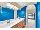 Bathroom featuring a double sink vanity and access to the outdoor area. Ready for renovation at 2094 N Sweetwater Dr, Casa Grande, AZ 85122