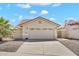 Charming single-story home showcasing a neutral color palette, tiled roof, and a spacious two-car garage at 2094 N Sweetwater Dr, Casa Grande, AZ 85122