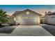 Charming single-story home with a well-maintained front yard and a two-car garage at 2094 N Sweetwater Dr, Casa Grande, AZ 85122