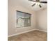 This bedroom has tile flooring and a window letting in natural light at 2111 N Piper Pl, Mesa, AZ 85215