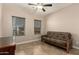 Bedroom featuring a ceiling fan, tile flooring, and a futon couch at 2111 N Piper Pl, Mesa, AZ 85215