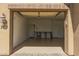 Open garage with door to house and back door to outside at 2111 N Piper Pl, Mesa, AZ 85215