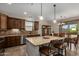 Kitchen with granite countertops, barstool seating, and stainless steel appliances at 2111 N Piper Pl, Mesa, AZ 85215