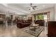 Open-concept living room with tile flooring, comfortable seating, and backyard views at 2111 N Piper Pl, Mesa, AZ 85215